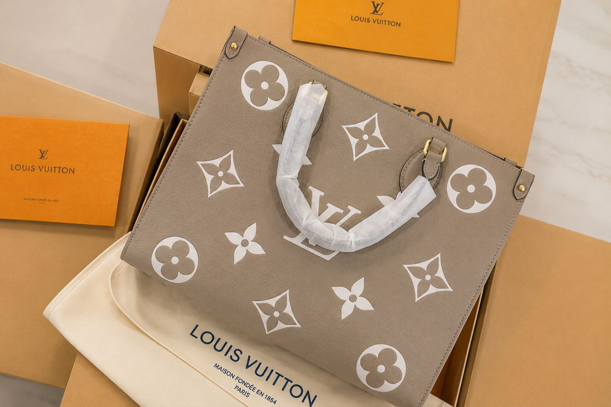 Elegant taupe-grey tote bag featuring a premium monogram pattern, spacious interior and comfortable handles. Perfect for everyday use, shopping, office and casual outings.